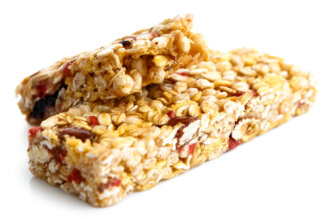 One and half muesli bars isolated on white.